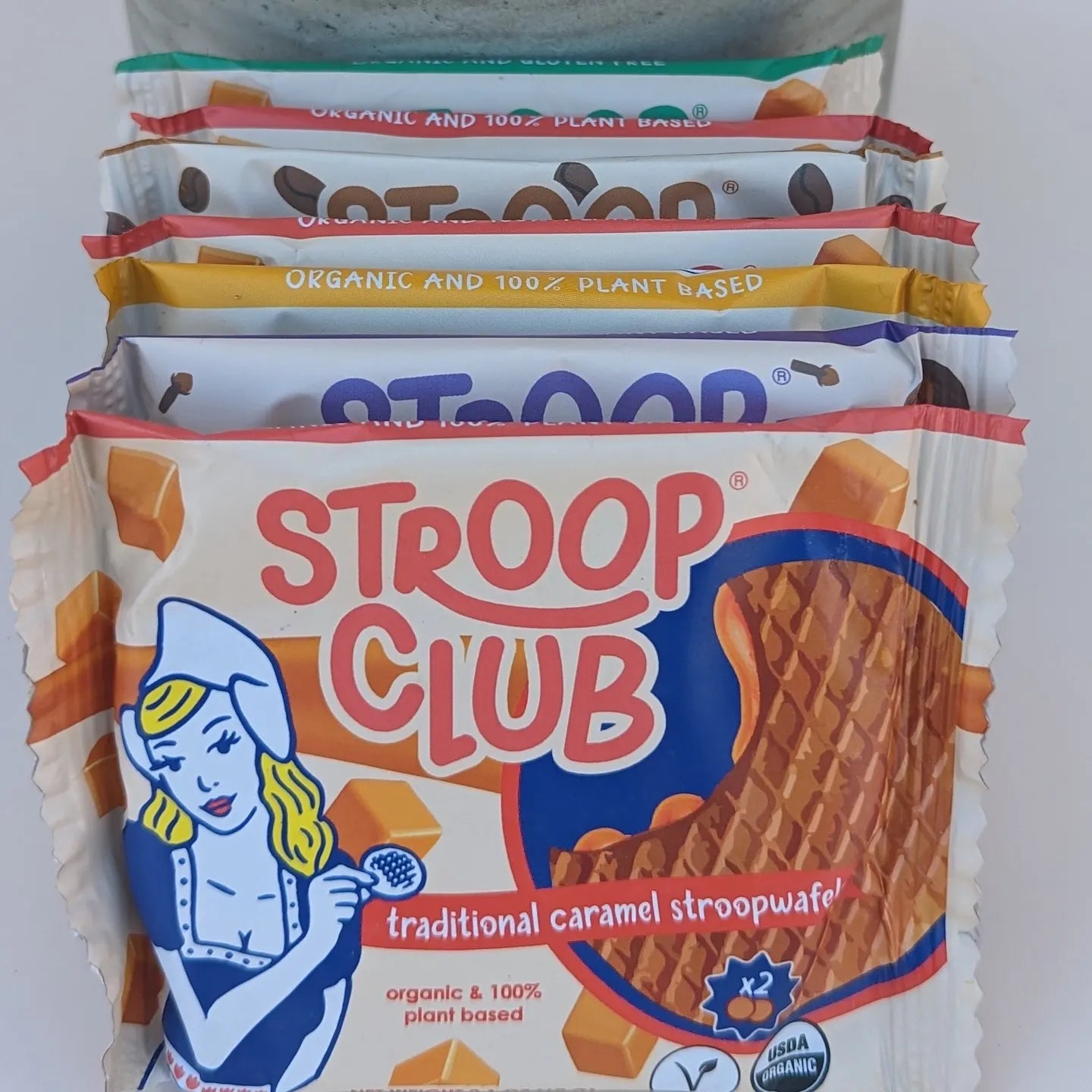 Piicture of different flavors of stroop club stroopwafel 2-packs